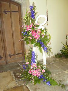 Picture of lilies amd delphiniums on floral stand