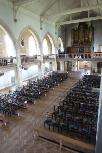 Nave picture taken from the gallery showing decorations for a forthcoming wedding
