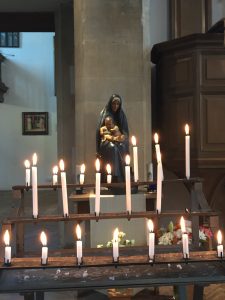 Burning Candles before Mary and Jesus